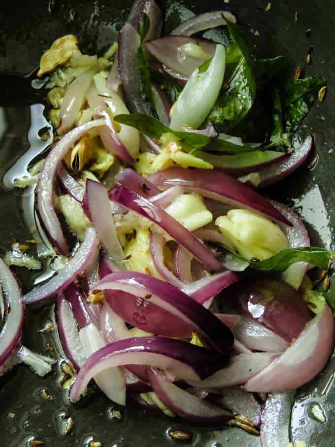 tempering onions and spices for the chikpea potato curry.