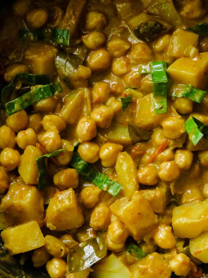 Indian chickpea and potato curry in a pan.