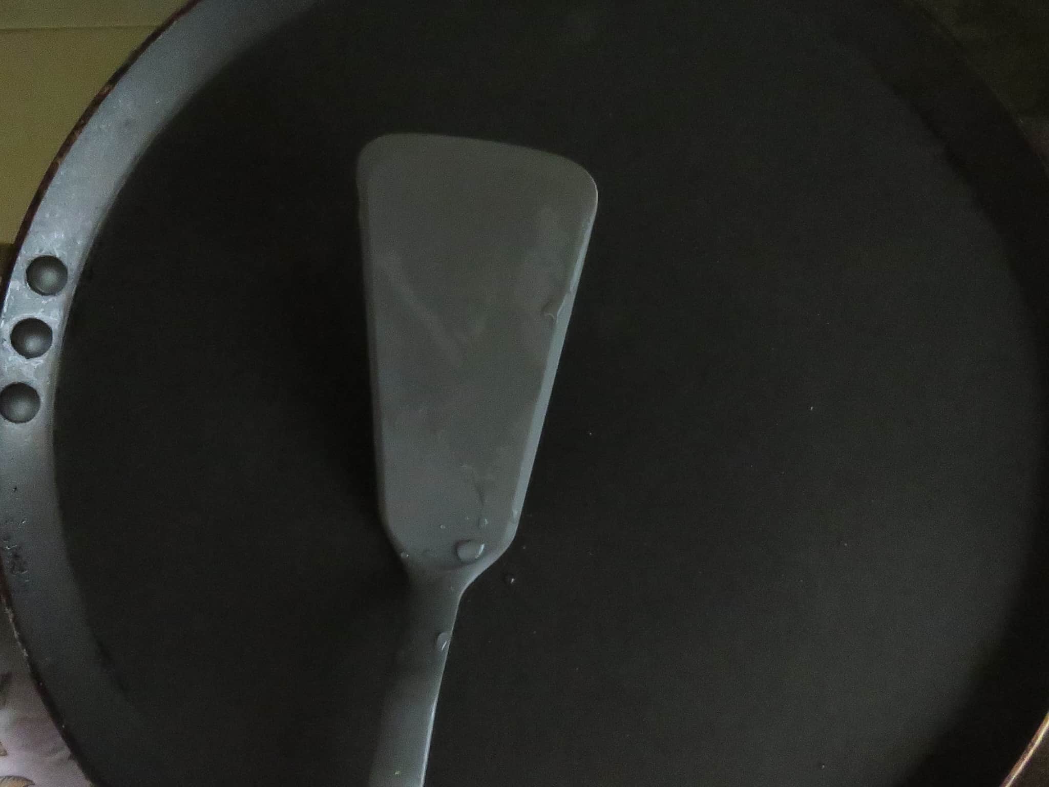 image shows a large flat pan with spatula to make multiple pancakes at once.