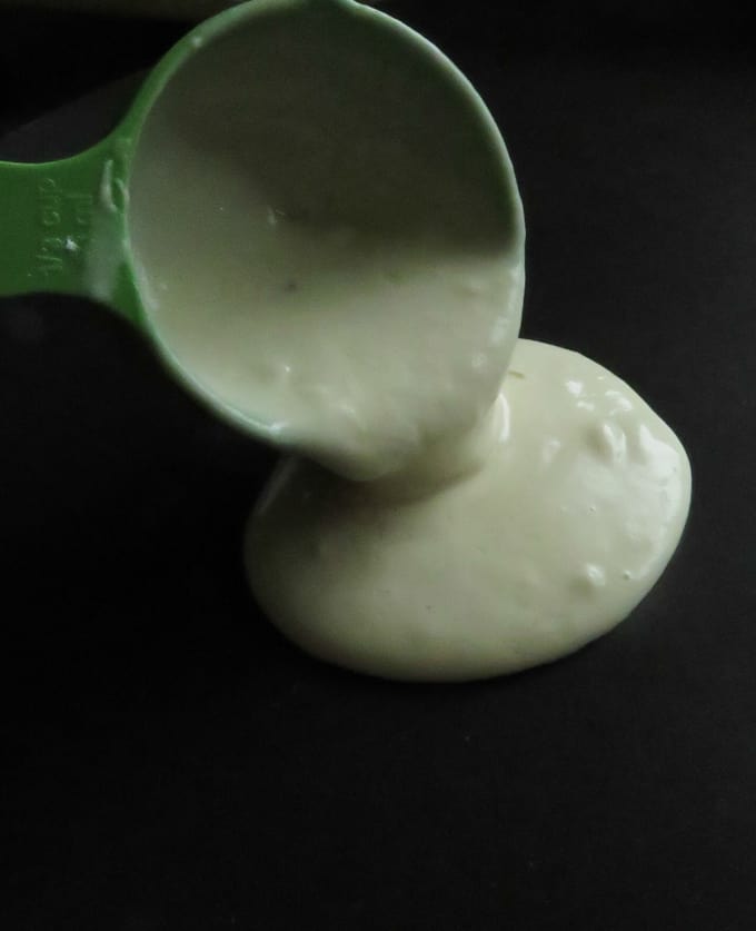 image shows the batter consistency for eggless pancakes.