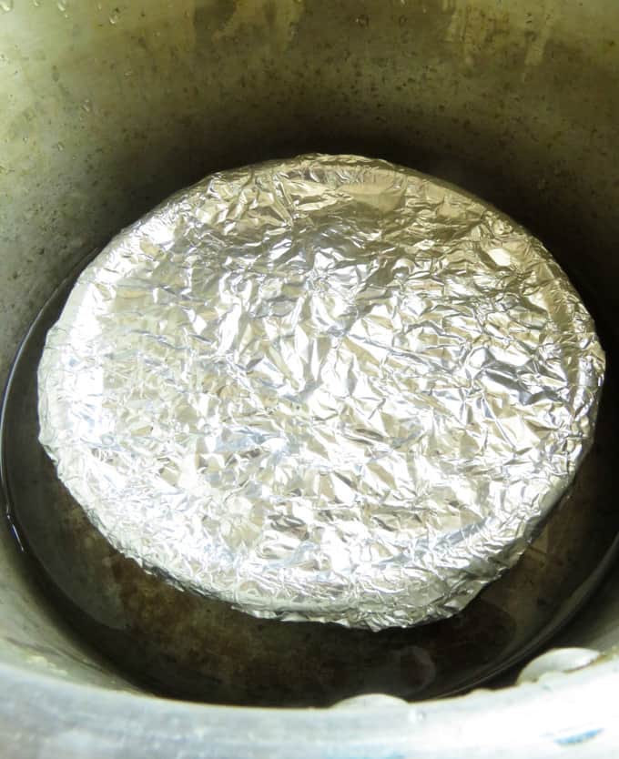 jaggery pudding bowl inside a pressure cooker.