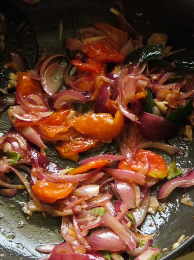 cooking onions, tomatoes to make the curry spiced sloppy joes.