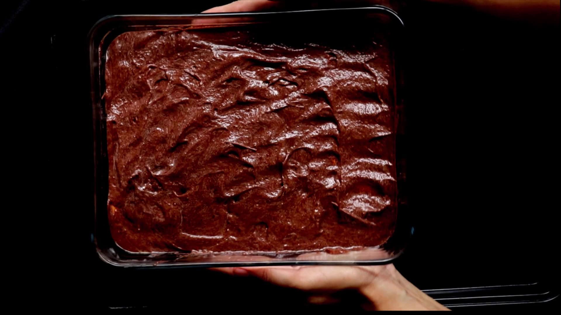 chocolate biscuit pudding made in a pyrex dish and served.