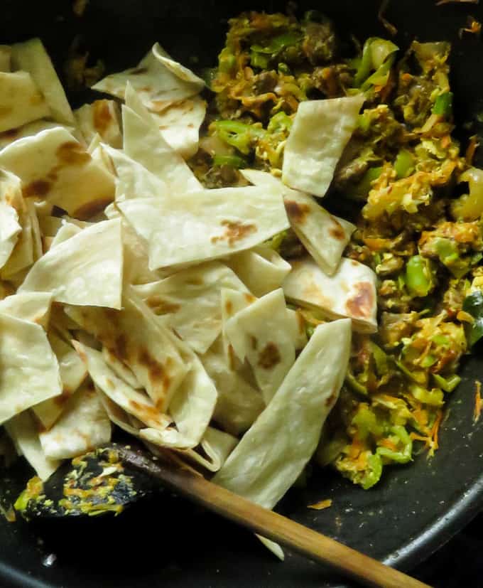 added sliced parathas to the mixture of beef kottu.