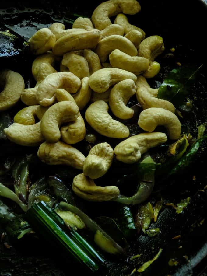 soaked cashew added to the onion temper in the pan.