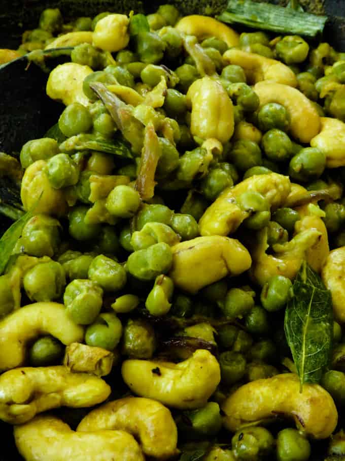 cashew and green peas curry in a pot.