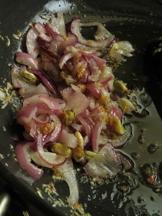 temper onions, ginger-garlic and spices in a pan.