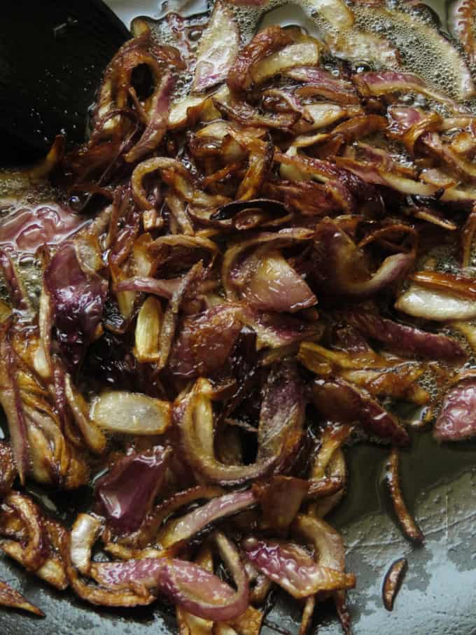 deep frying onions in a pan.