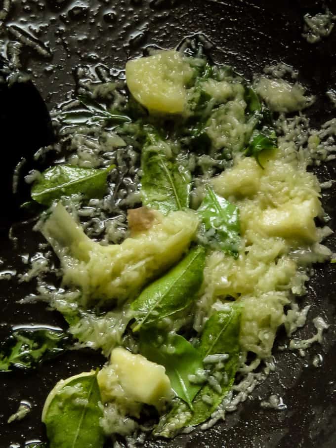 tempering ginger=garlic, curry leaves to make the dolphin kottu.