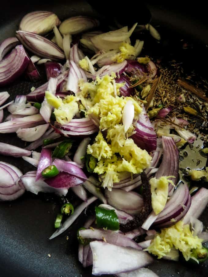 onions, gigner, garlic, green chillies and spices ready to be sauteed to make the egg biryani masala.