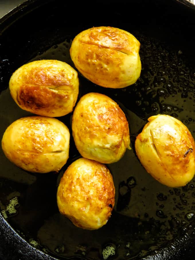 fried eggs shown in a platter.