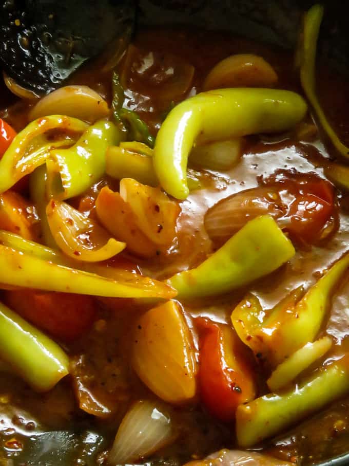 making a thick sweet and spicy sauce to make the deviled fish stir fry.