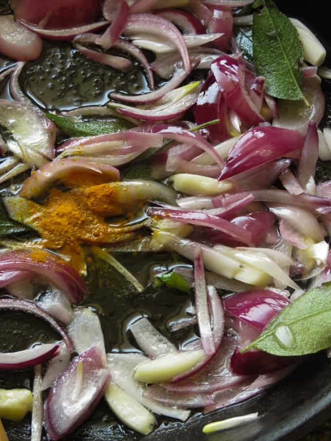 caramelizing the onions with turmeric for the apple stir-fry.