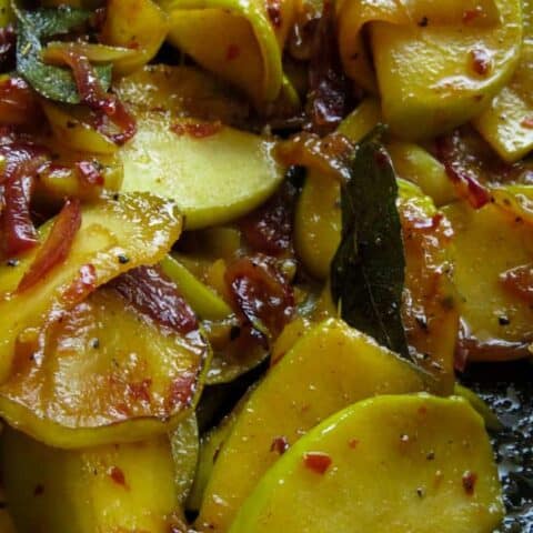 slices of apples stir-fried with onions and turmeric powder.le stir-fry