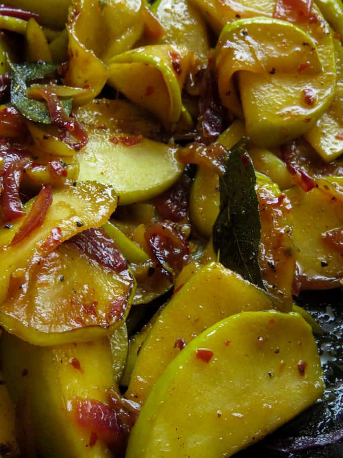 slices of apples stir-fried with onions and turmeric powder.le stir-fry