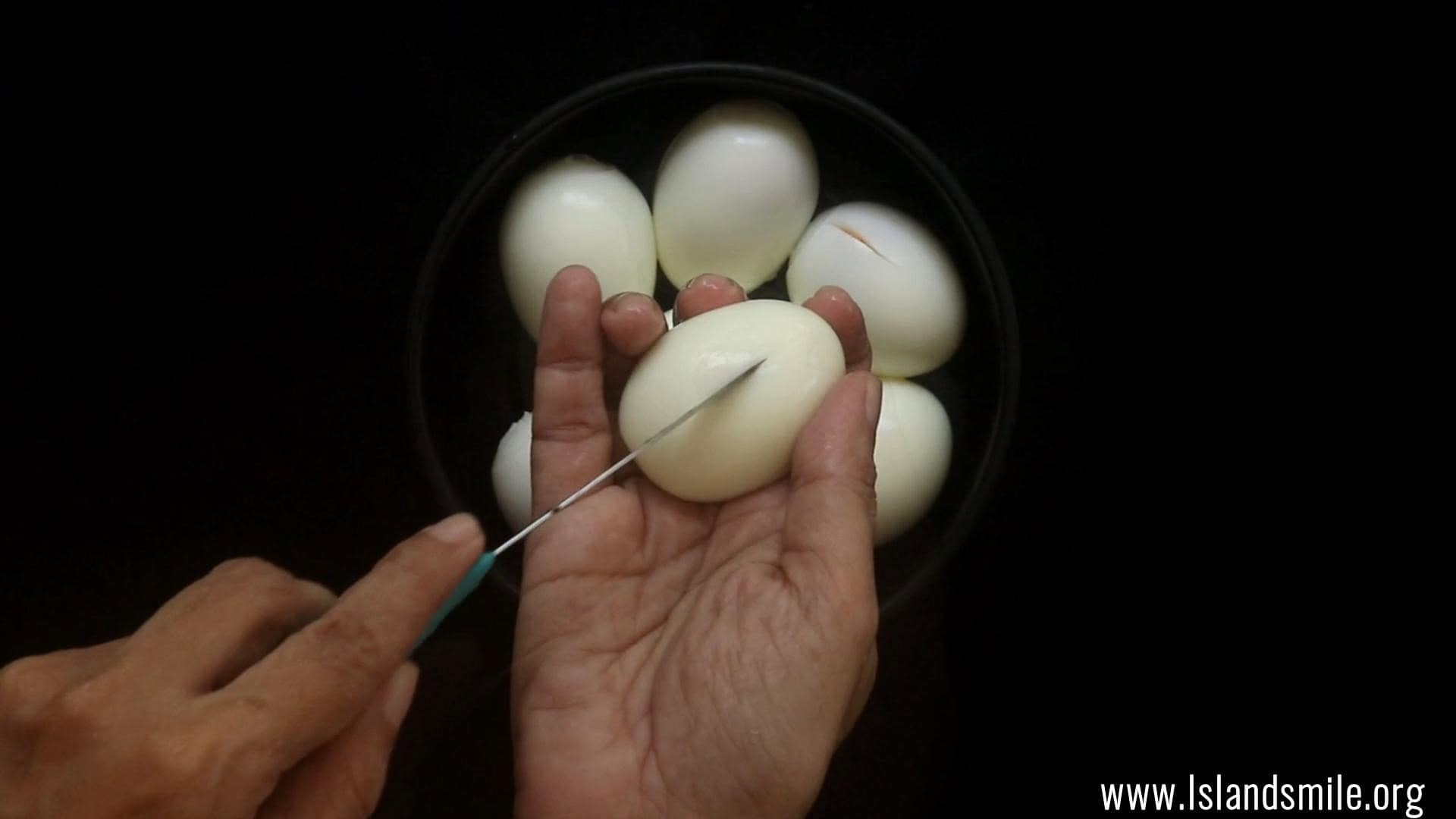 slit the eggs to fry and cook the egg biryani.