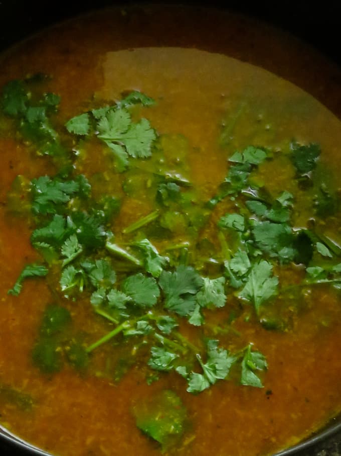 once the tomato rasam is cooked, add the chopped the coriander leaves.