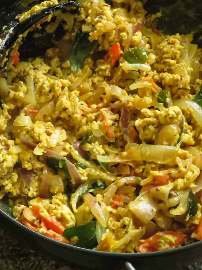 spicy scrambled eggs in a frying pan.