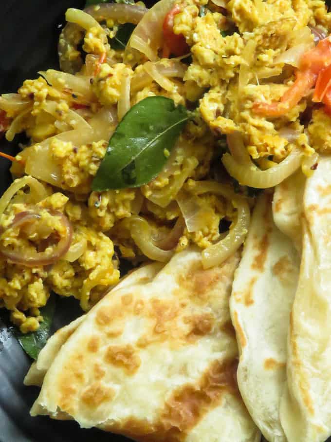 onions, tomatoes with scrambled eggs and served with roti.