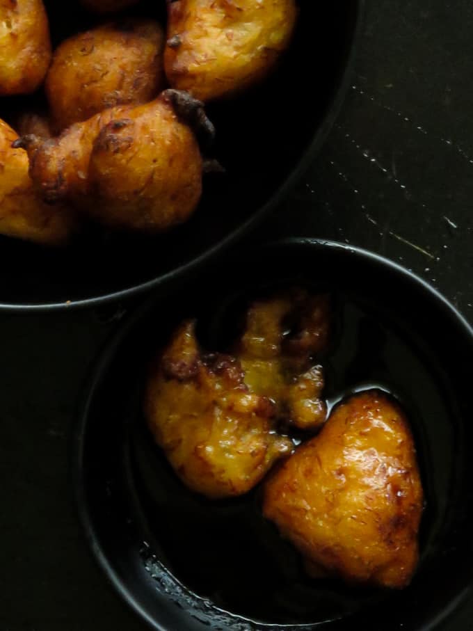 fried banana fritters(pisang goreng)soaked in jaggery syrup.