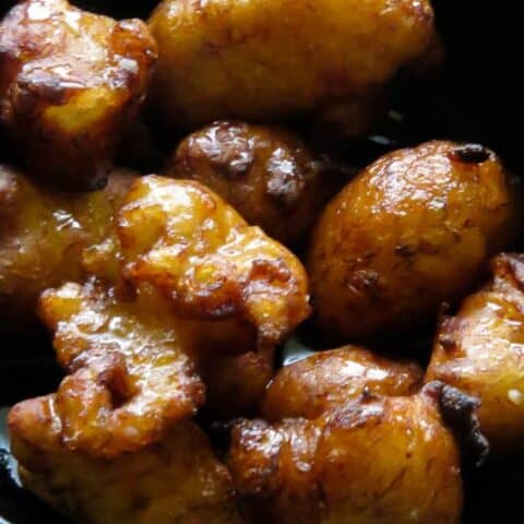 pisang goreng(mashed banana fritters in a bowl.