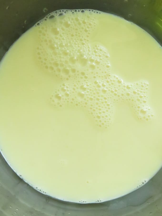 adding gelatine to the condensed milk powder to make the pineapple pudding.