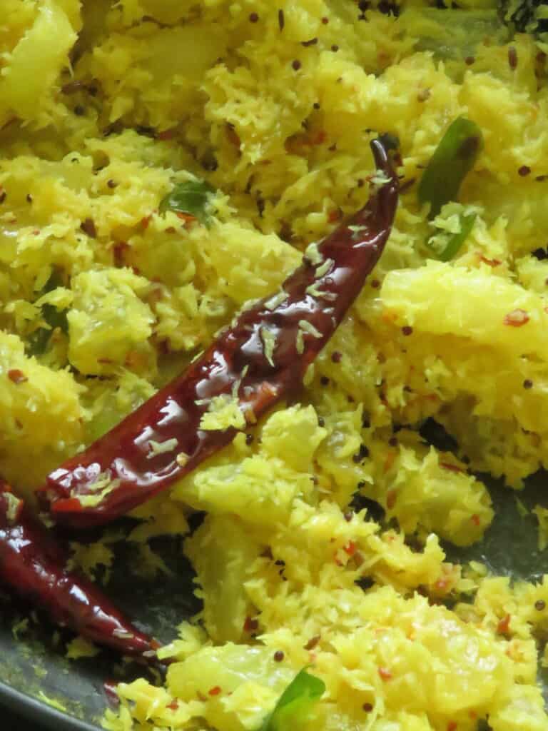 easy cucumber stir fry with scraped coconut and dried red chillies.