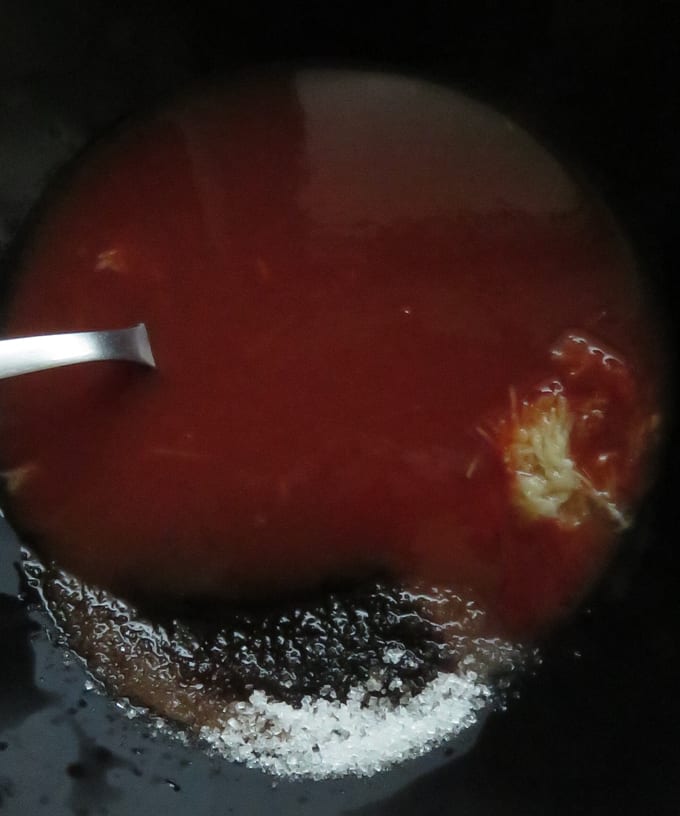 mixing ketchup, sugar, garlic, soy sauce, water to make the sweet and sour sauce.