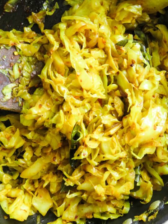 spicy cabbage stir fry in cooked with 5 ingredients in a frying pan.