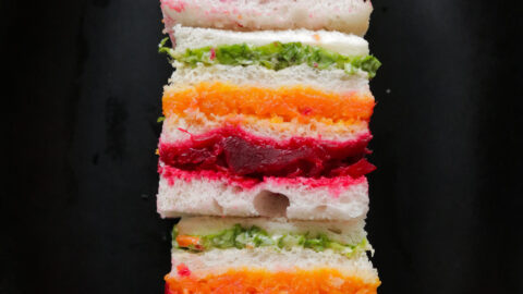 Stack of ribbon or rainbow sandwiches served on a platter