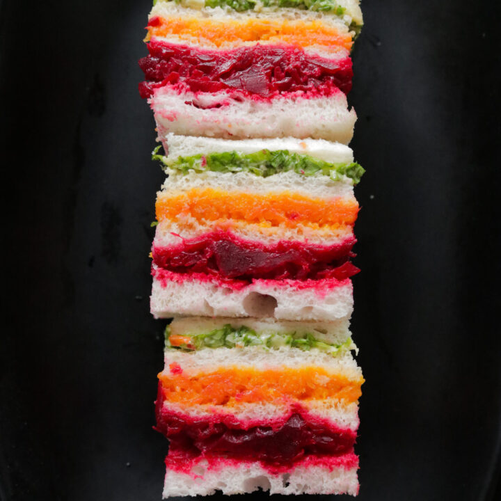 Stack of ribbon or rainbow sandwiches served on a platter