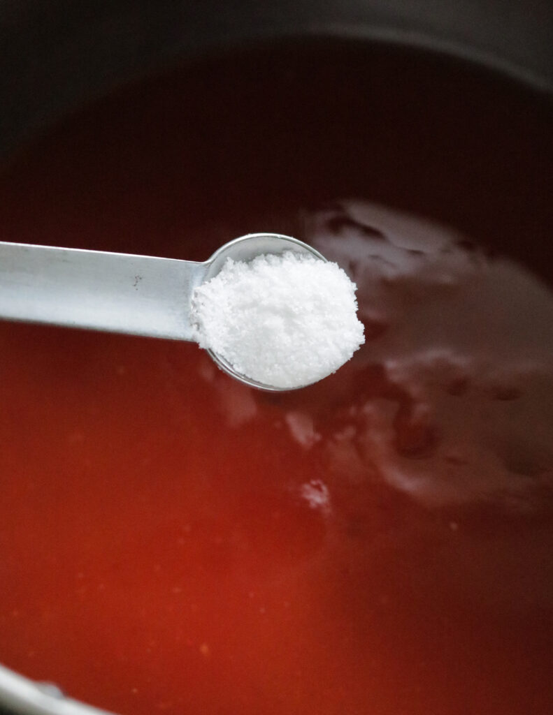 adding salt to make the spicy bbq sauce