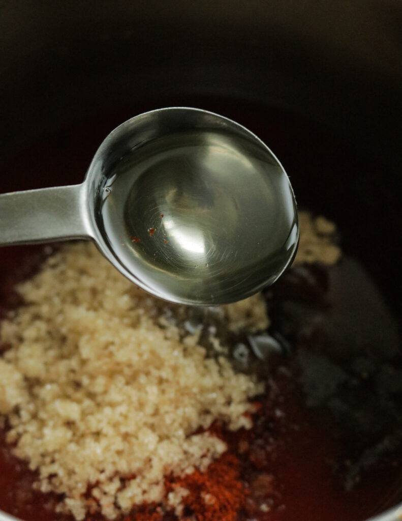 adding oil to make the varbecue sauce