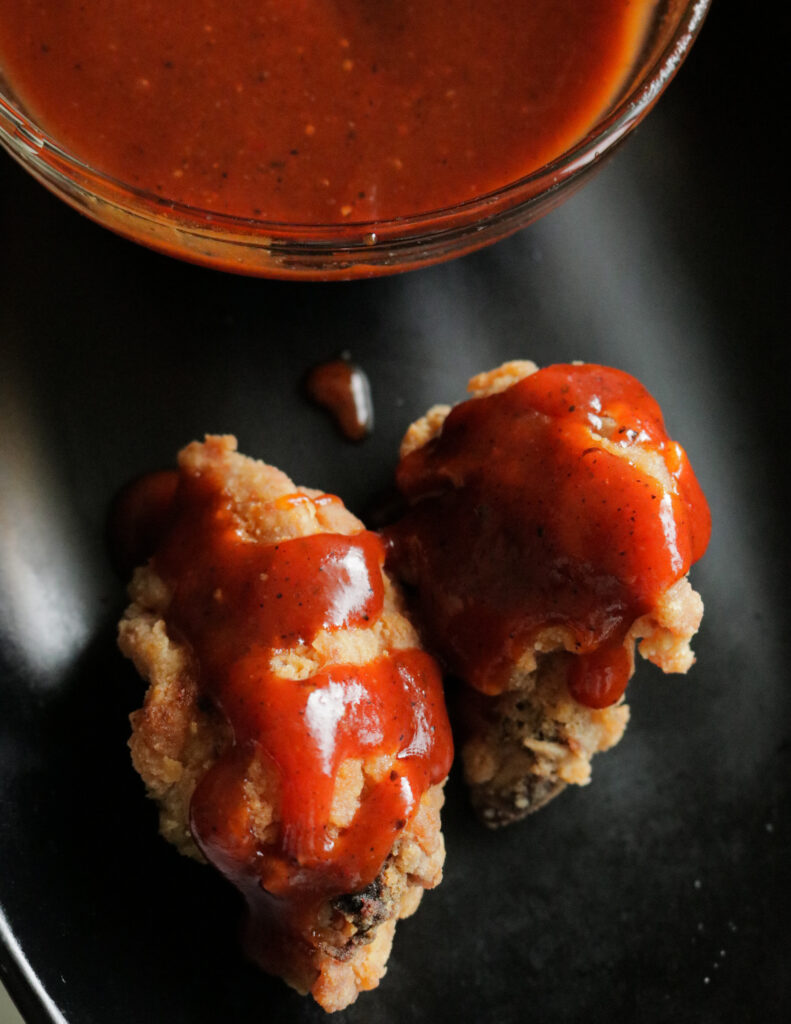 spicy BBQ sauce, sweet and spicy, drizzled over fried chicken wings.