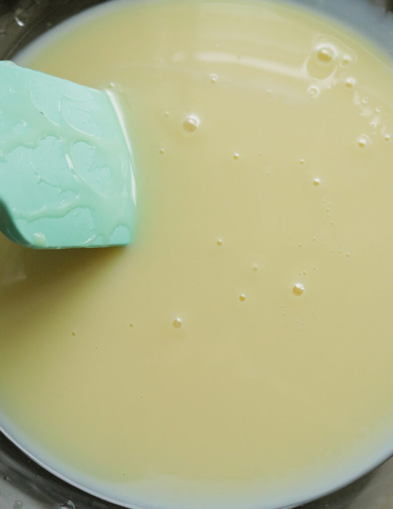 condensed milk poured into a bowl.