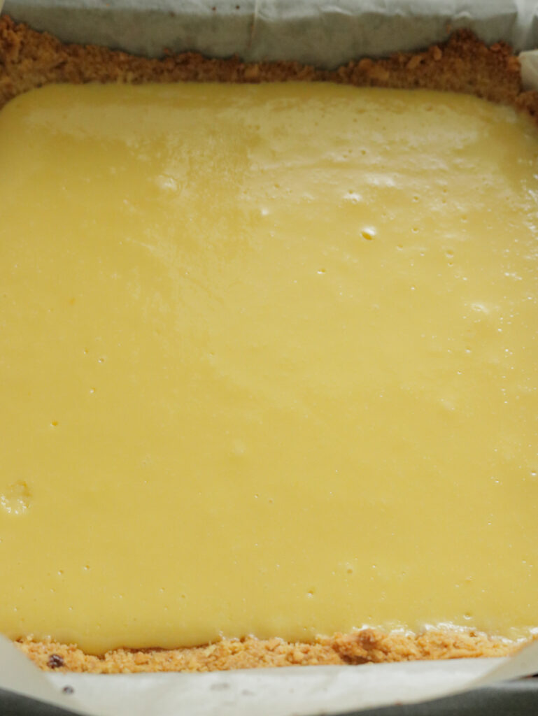 lemon filling poured into a crust and ready to bake.