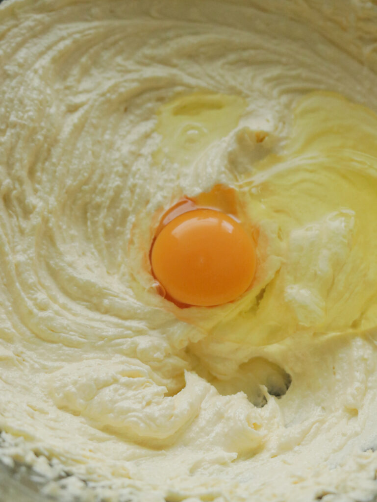 adding egg yolk to make the ribbon cake