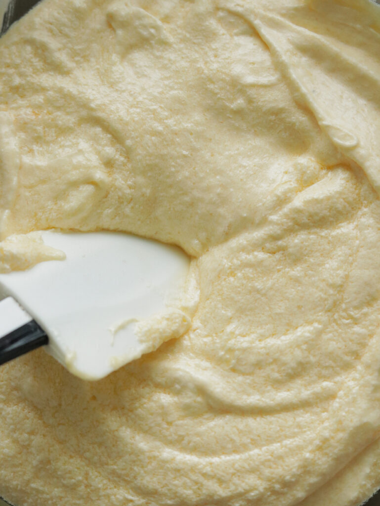 mixing the egg and creaming the ingredients to make the ribbon cake