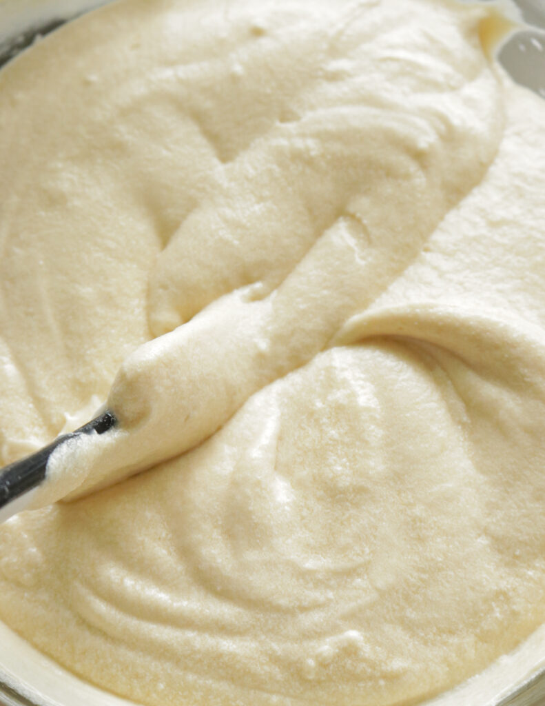 mixing the batter to make the ribbon cake