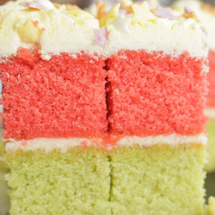 slices of ribbon cake with butter cream frosting.