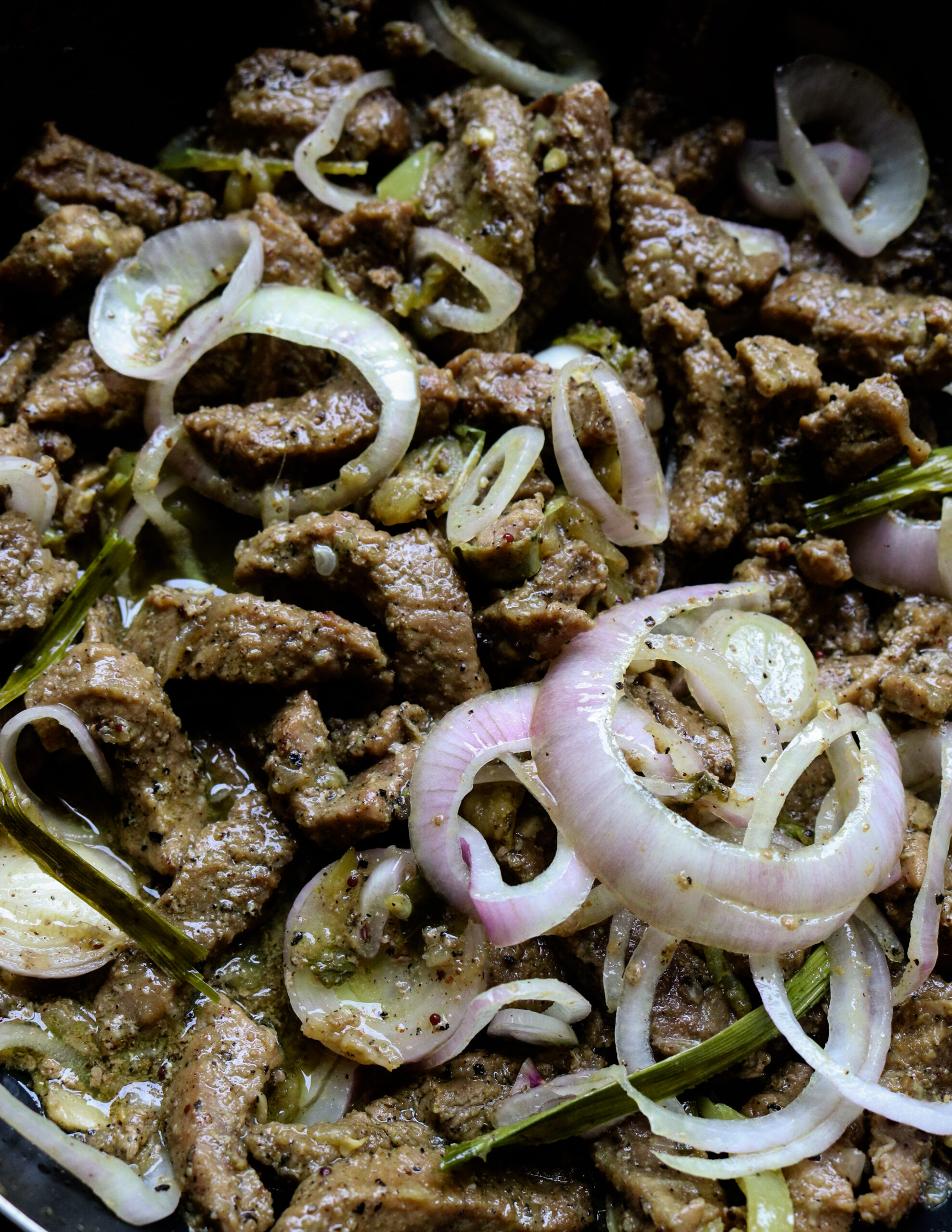 beef bisteak with onions and peppers.