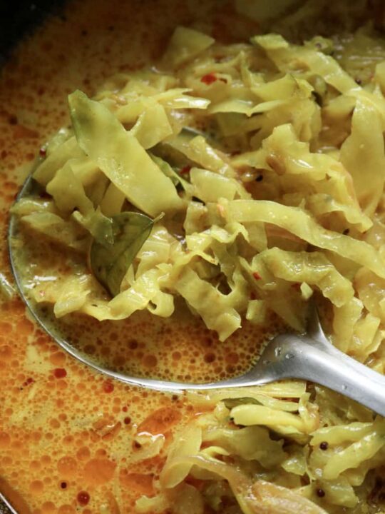 Sri lankan cabbage curry with a spoon in it