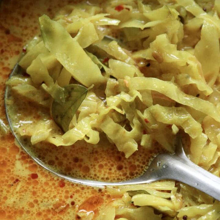 Sri lankan cabbage curry with a spoon in it