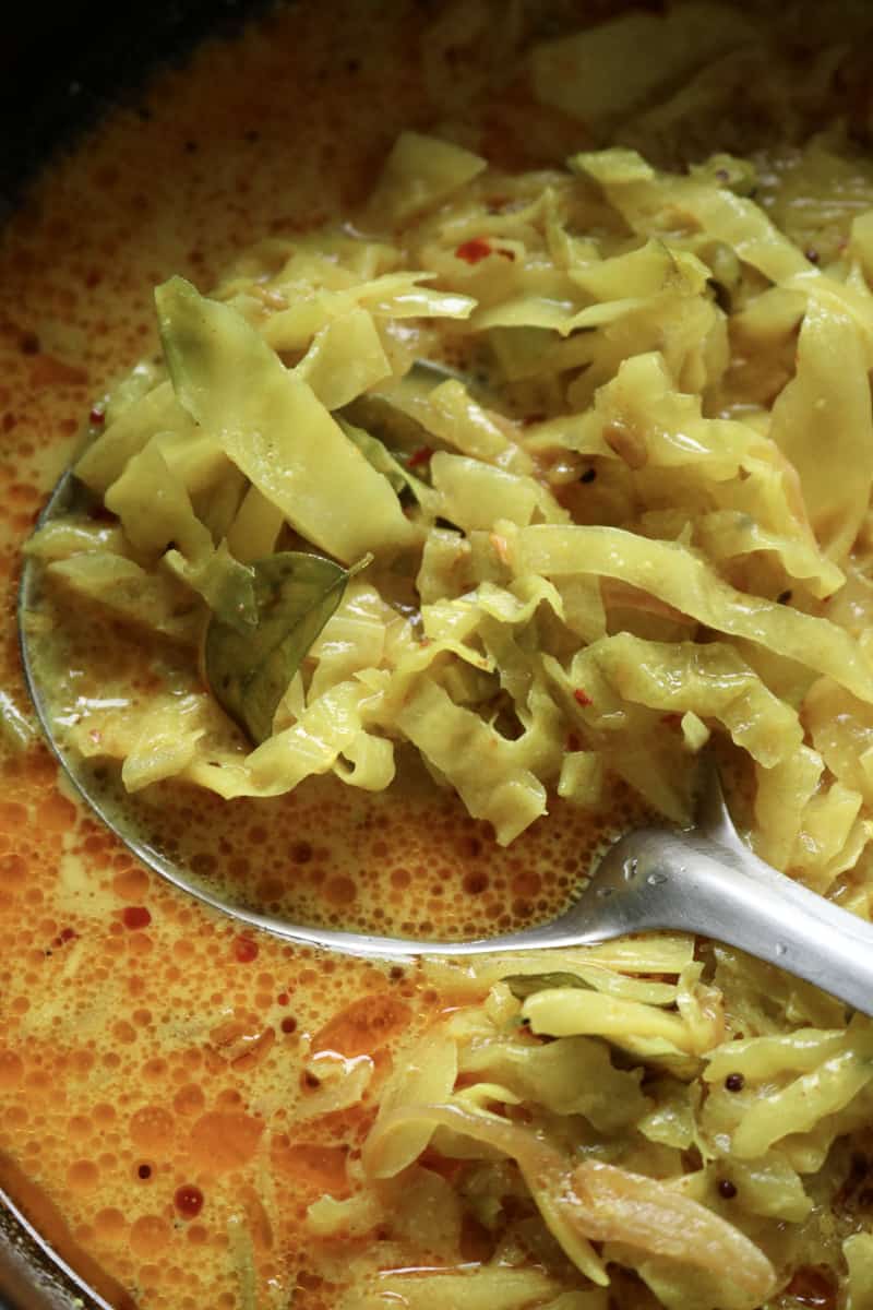 Sri lankan cabbage curry with a spoon in it