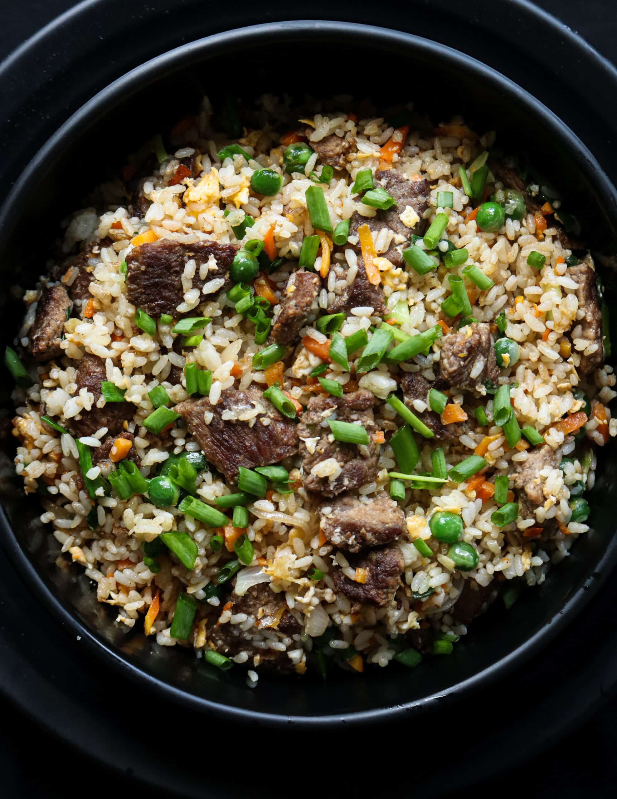 easy beef fried rice served in a back bowl.