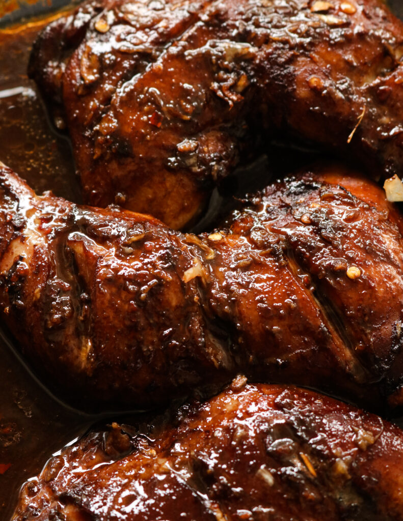 baked chicken in teriyaki sauce in a pyrex dish.