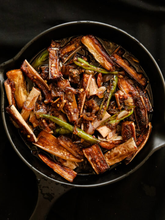 eggplant stir fry served in a black platter.