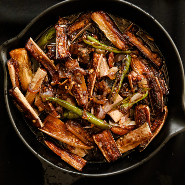 eggplant stir fry served in a black platter.