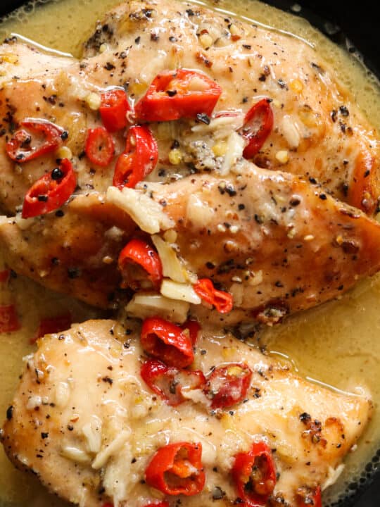 lemon chicken with chillies garnishing the chicken breasts