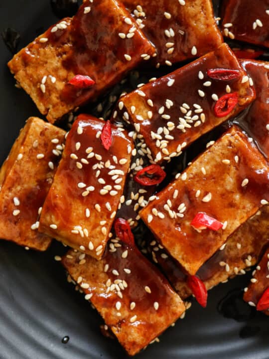 teriyaki tofu served sprinkled with sesame seeds.